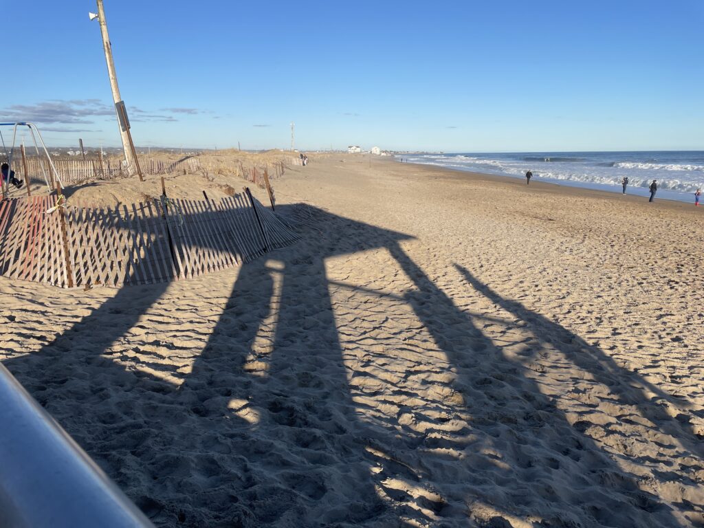 a sandy beach with a fence (MyCoast AI)