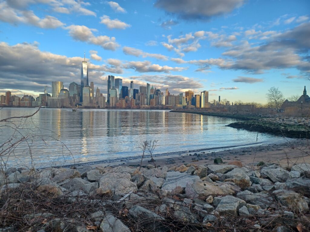 a city skyline across a body of water (MyCoast AI)