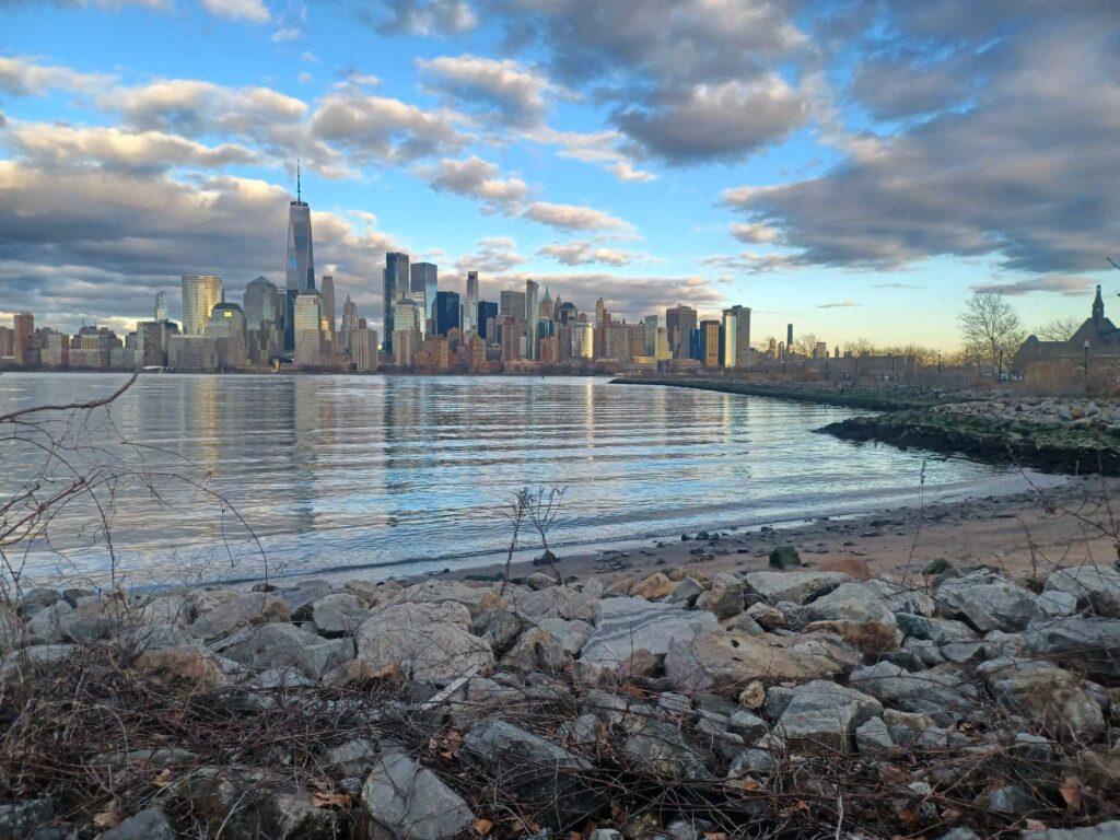 a city skyline across a body of water (MyCoast AI)