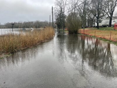 a flooded road with a van parked on the side (MyCoast AI)