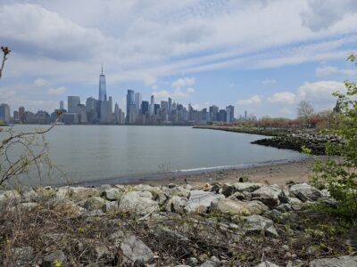 a city skyline across a body of water (MyCoast AI)