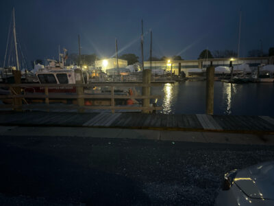 a dock with boats at night (MyCoast AI)