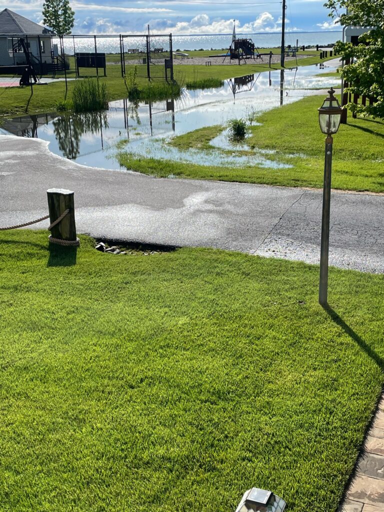 a flooded street with a puddle (MyCoast AI)