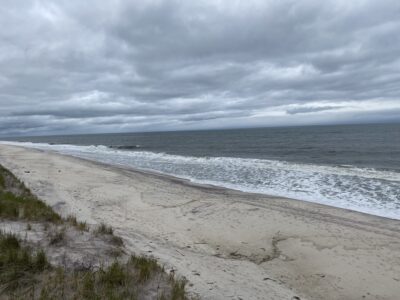 a beach with waves crashing on it (MyCoast AI)