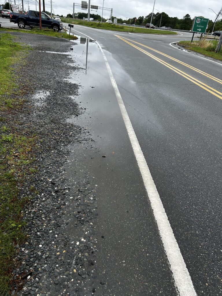 a road with a sign on it (MyCoast AI)