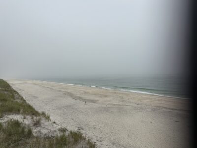 a beach with waves crashing on it (MyCoast AI)