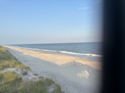 a beach with waves crashing on it (MyCoast AI)