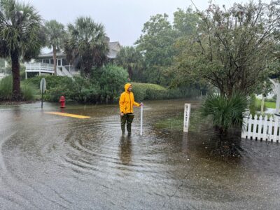 a man standing in a flooded street (MyCoast AI)