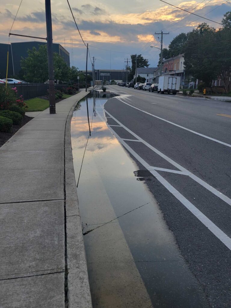 a street with cars parked along it (MyCoast AI)