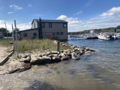 a building next to a body of water (MyCoast AI)