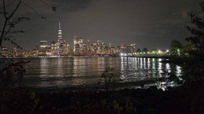 a city skyline across a body of water (MyCoast AI)