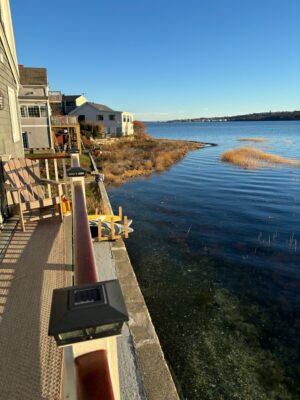 a building next to a body of water (MyCoast AI)