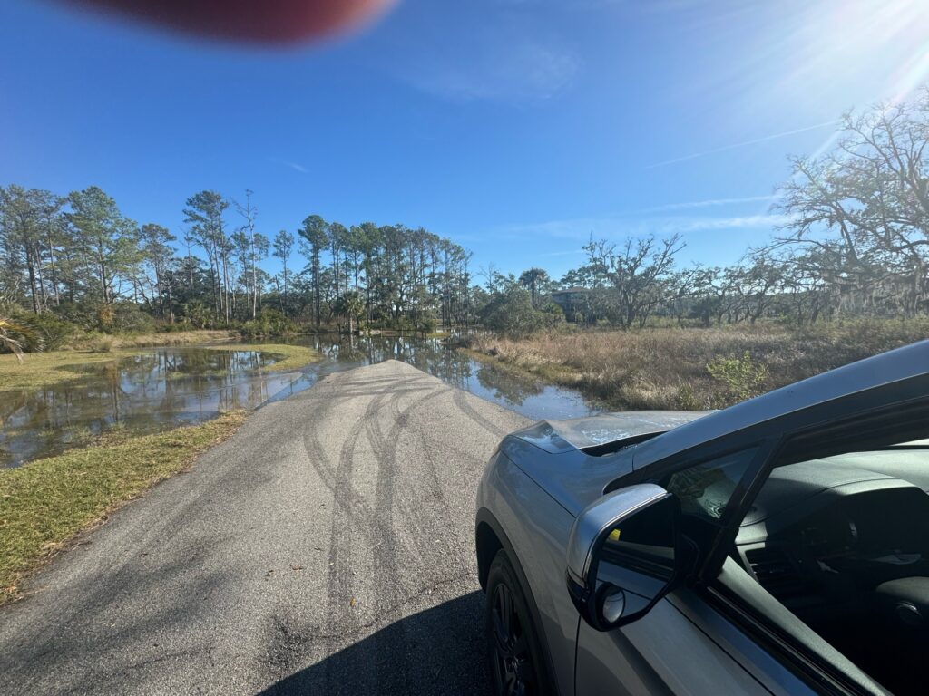 a car driving on a dirt road (MyCoast AI)