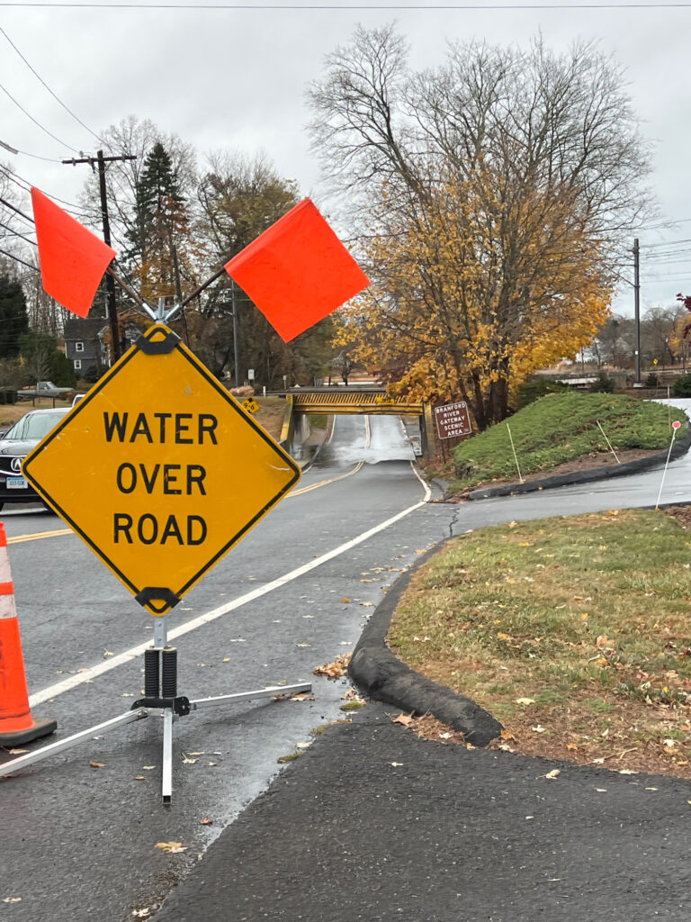 a yellow sign on the street (MyCoast AI)