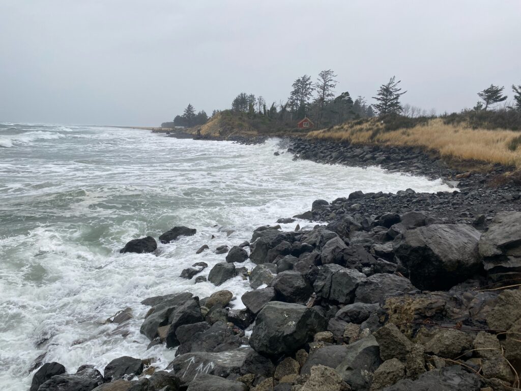 a rocky beach with waves crashing (MyCoast AI)