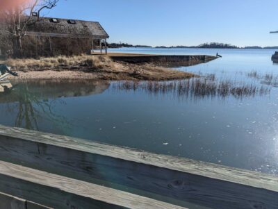 a body of water with a building in the background (MyCoast AI)
