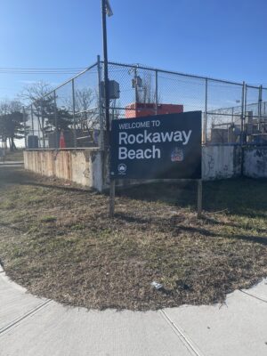 a sign on a fence (MyCoast AI)