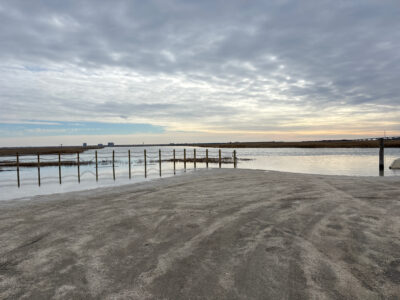 a beach with a pier (MyCoast AI)