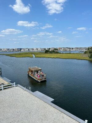 a boat with people on it on a river (MyCoast AI)