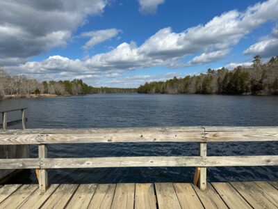 a wood deck overlooking a lake (MyCoast AI)