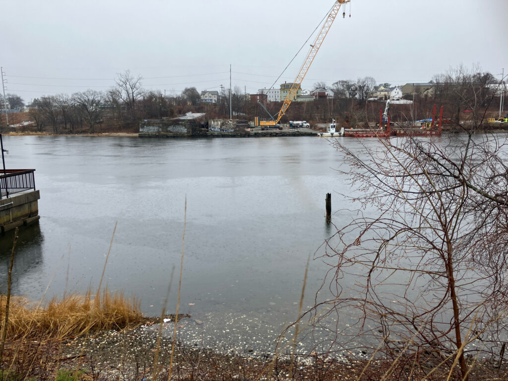 a body of water with a crane in the background (MyCoast AI)