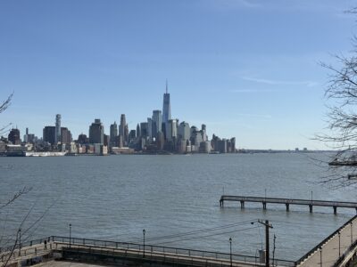 a city skyline across a body of water (MyCoast AI)