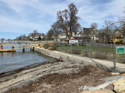 a fenced off area next to a body of water (MyCoast AI)