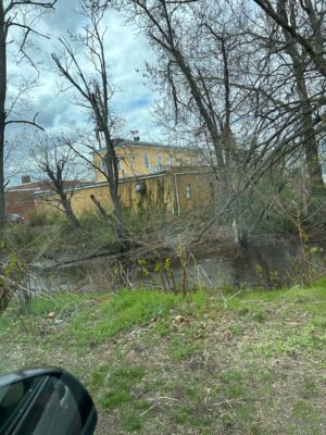 a building with a pond in front of it (MyCoast AI)