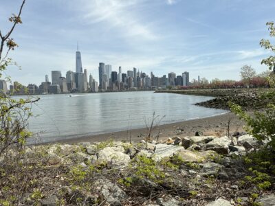 a city skyline across a body of water (MyCoast AI)