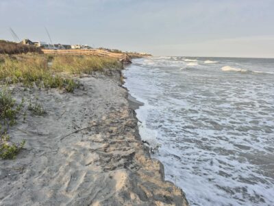 a rocky beach with waves crashing on it (MyCoast AI)