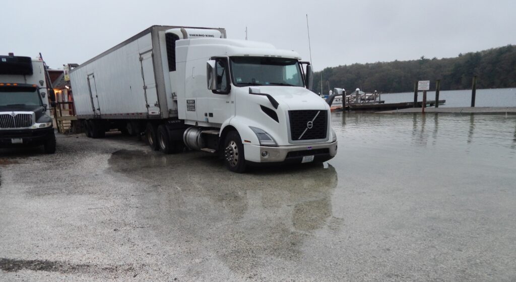 a white truck parked on a dock (MyCoast AI)