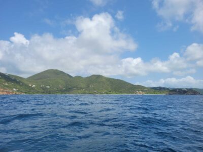 a body of water with hills in the background (MyCoast AI)