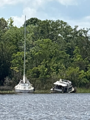 a couple of boats sit in a river (MyCoast AI)