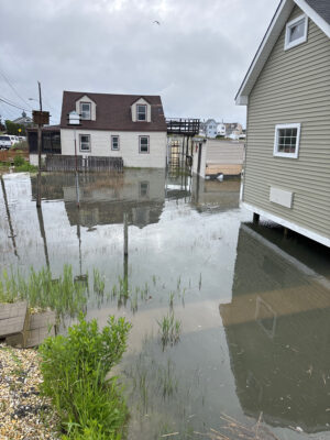 a flooded street with houses (MyCoast AI)