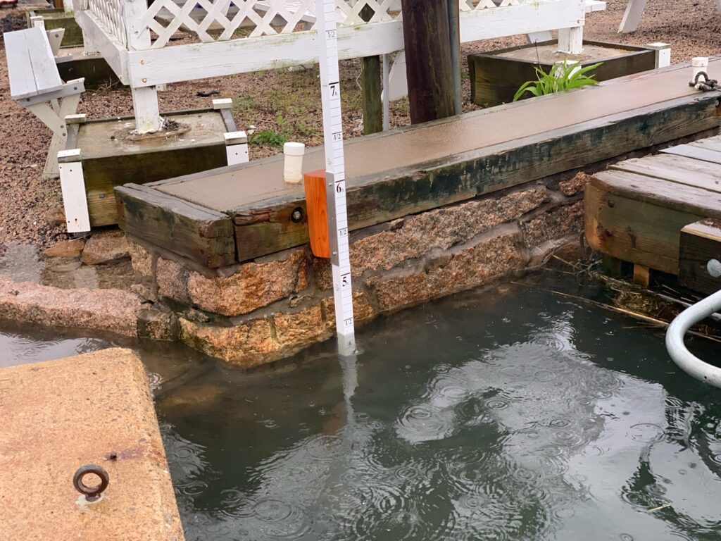 a water fountain with a white railing (MyCoast AI)