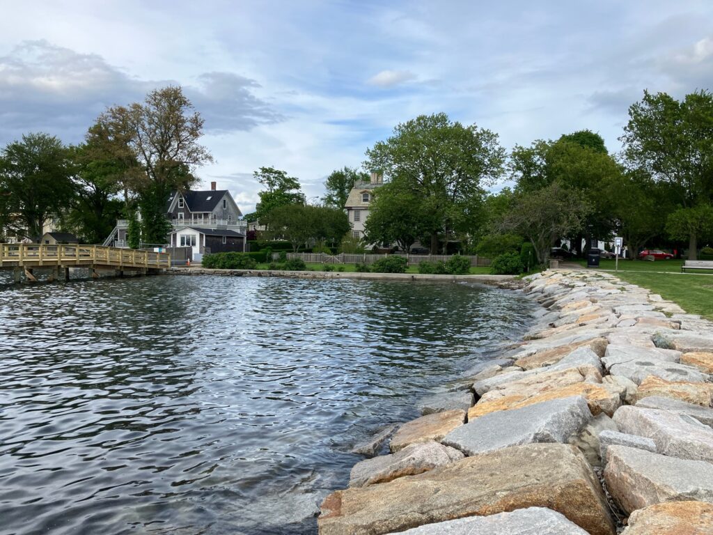 a body of water with rocks and trees around it (MyCoast AI)