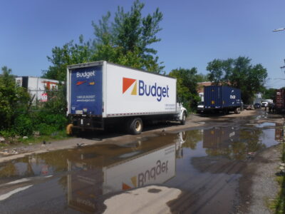 a truck driving through a flooded street (MyCoast AI)