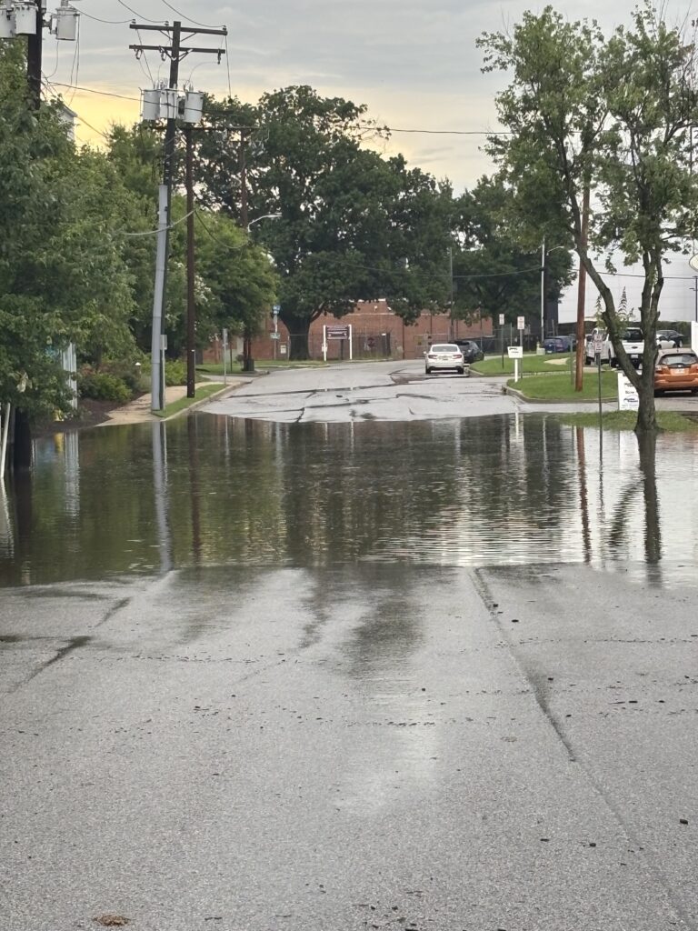 a street with water on the ground (MyCoast AI)