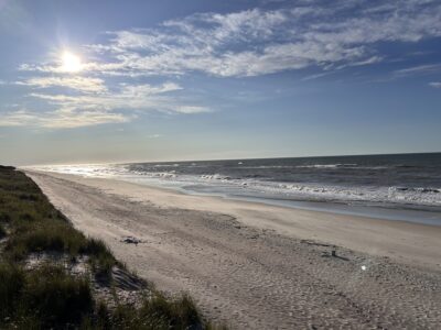 a beach with waves crashing on it (MyCoast AI)