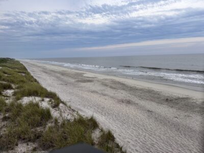 a beach with waves crashing on it (MyCoast AI)