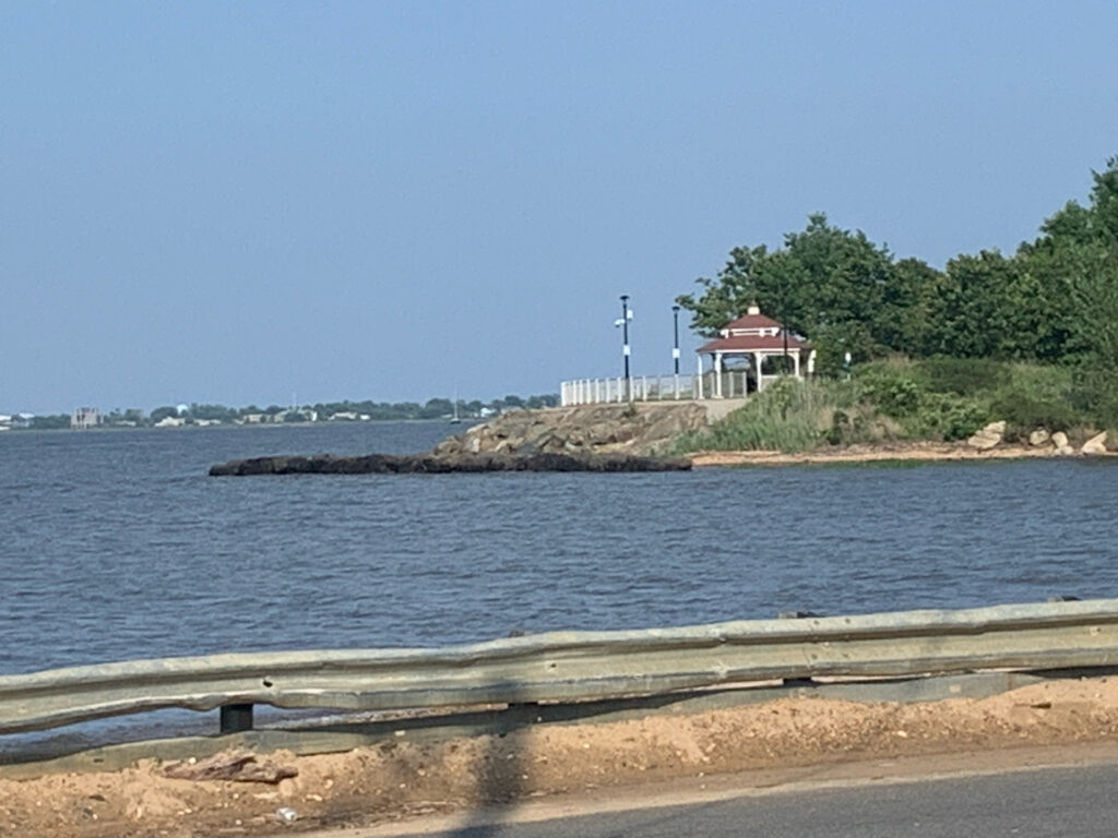 a body of water with a building on the shore (MyCoast AI)