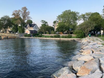 a body of water with rocks and trees around it (MyCoast AI)