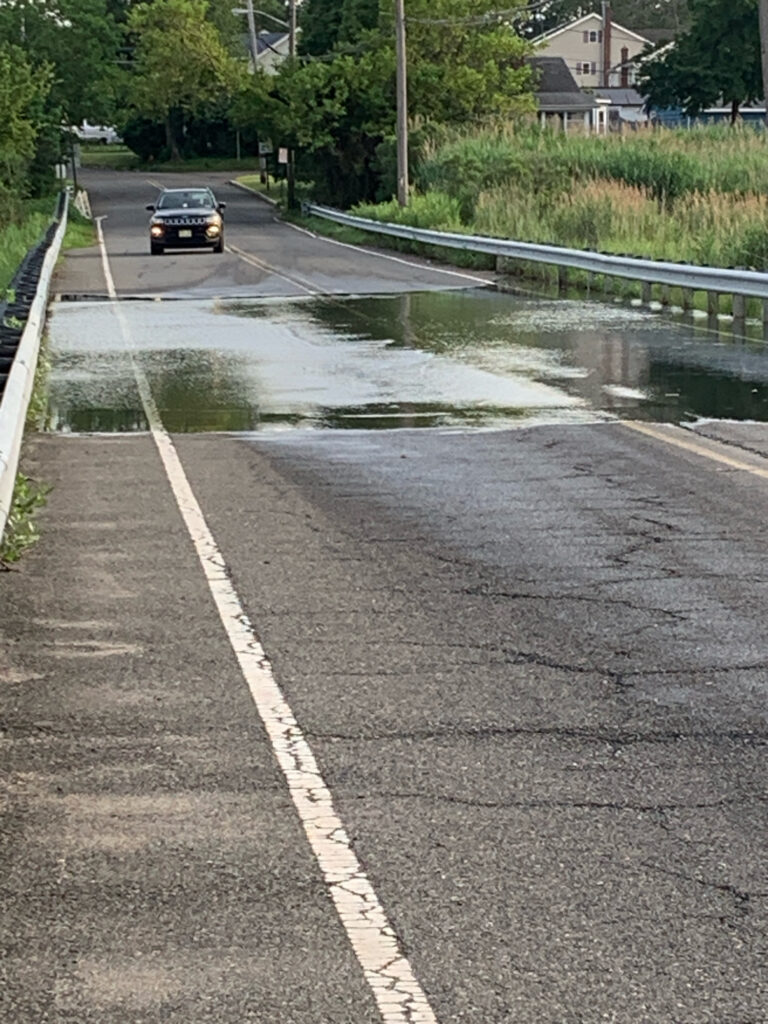 a car driving through a flooded street (MyCoast AI)