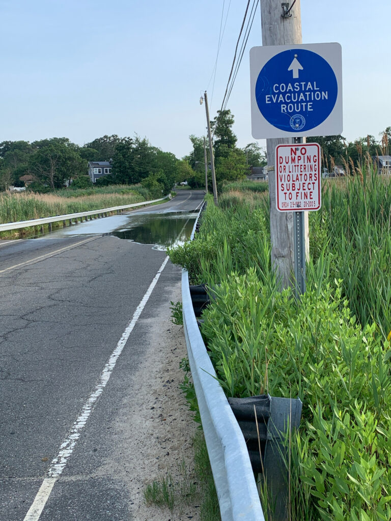 a sign on the side of a road (MyCoast AI)