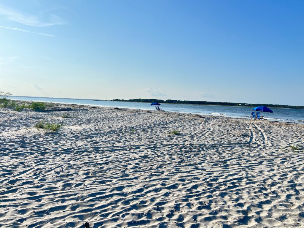 a beach with people and umbrellas (MyCoast AI)
