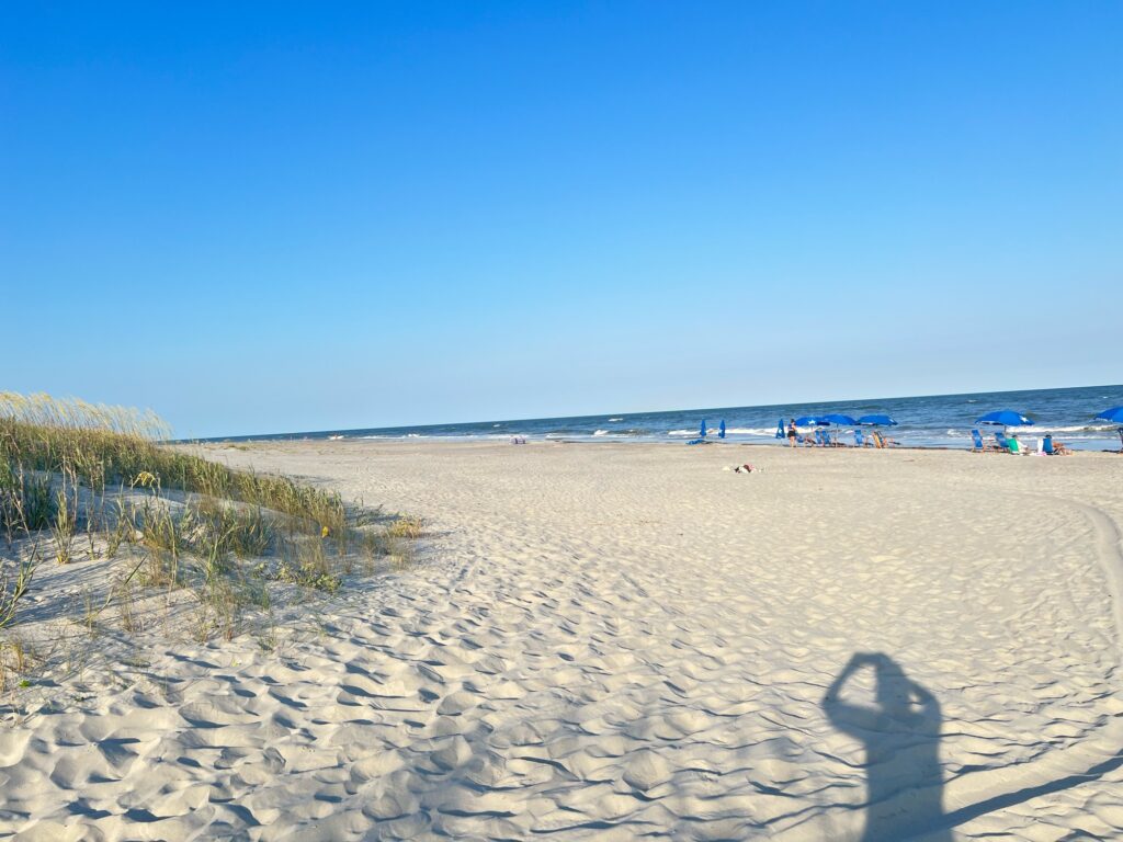 a sandy beach with people on it (MyCoast AI)