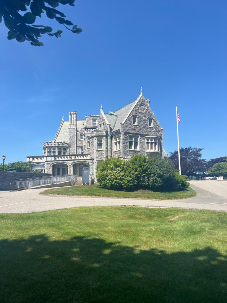 a large stone building with a flag on top (MyCoast AI)