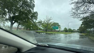 a car driving on a wet road (MyCoast AI)