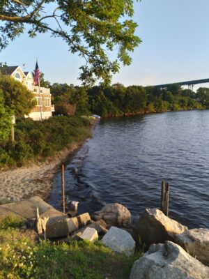 a river with rocks and a bridge (MyCoast AI)