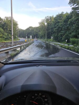 a car driving on a wet road (MyCoast AI)